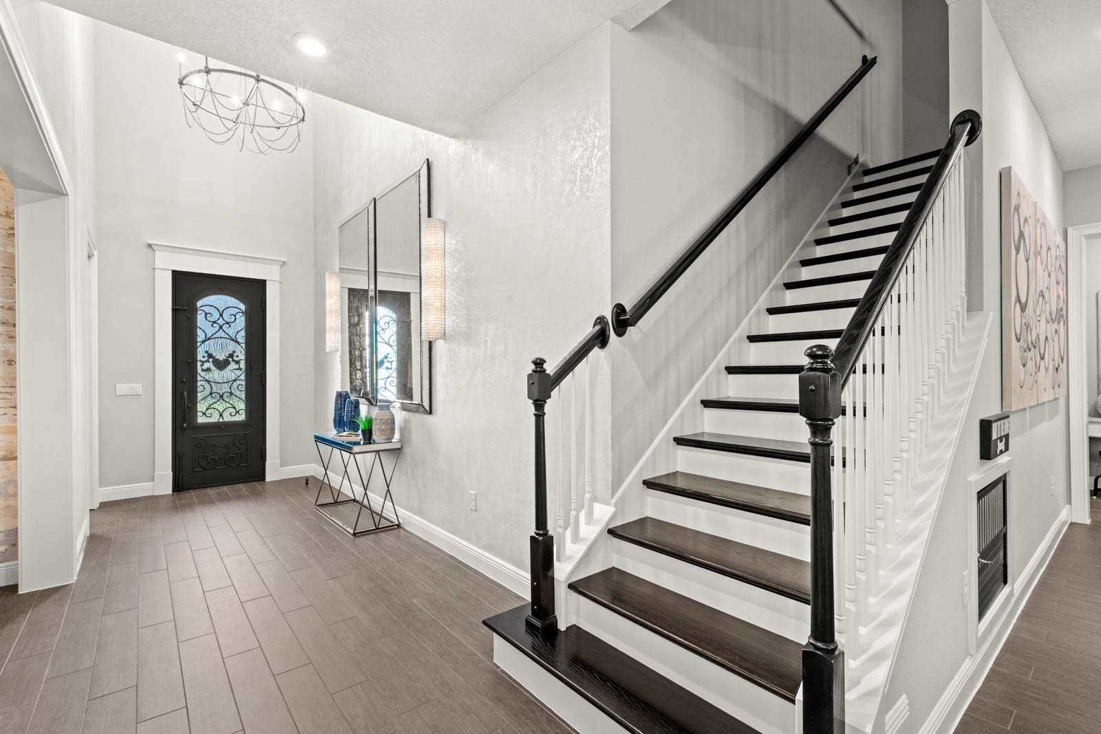 front entryway with white walls and stairs